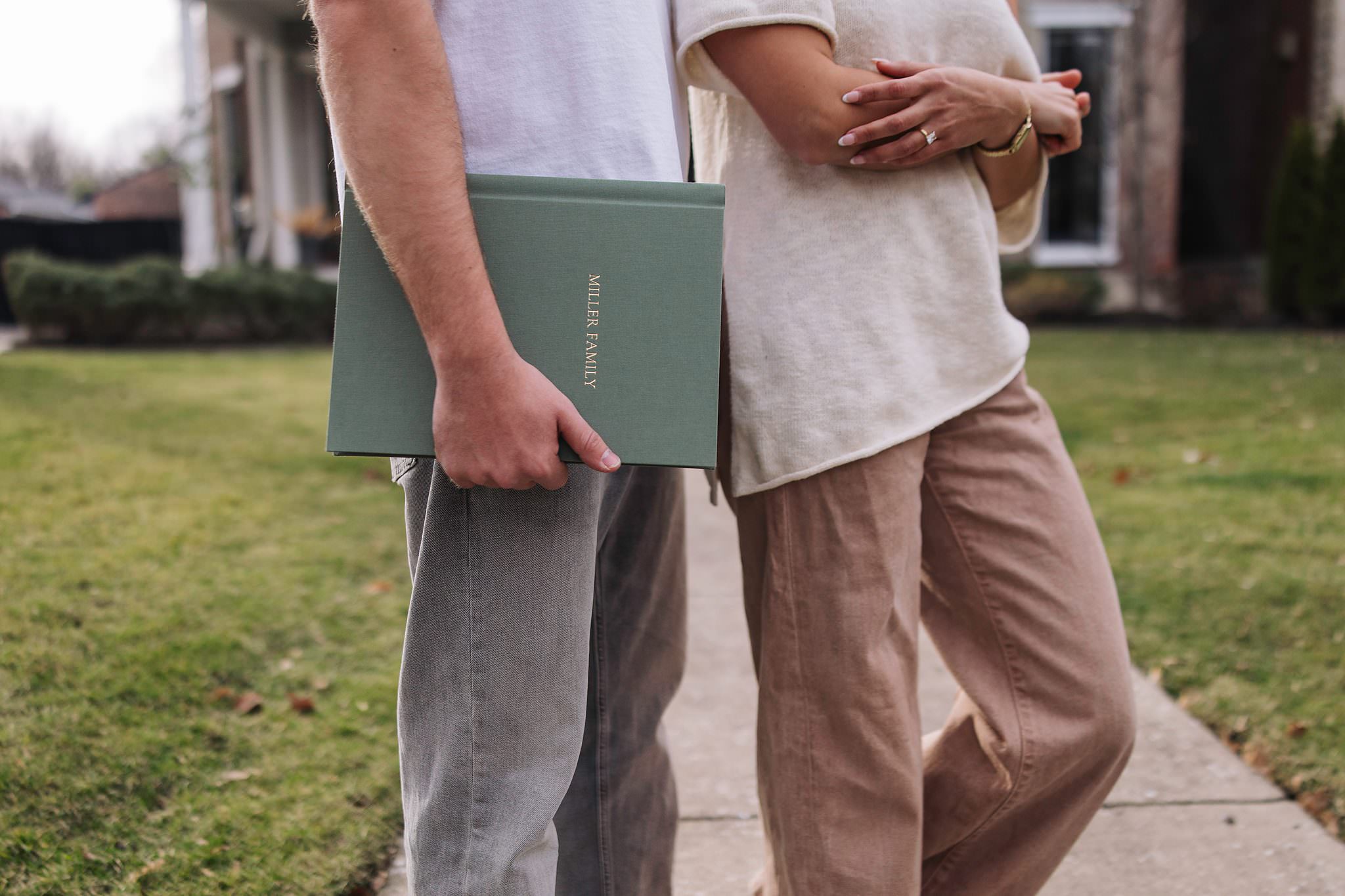 A couple walking with their Lite Album