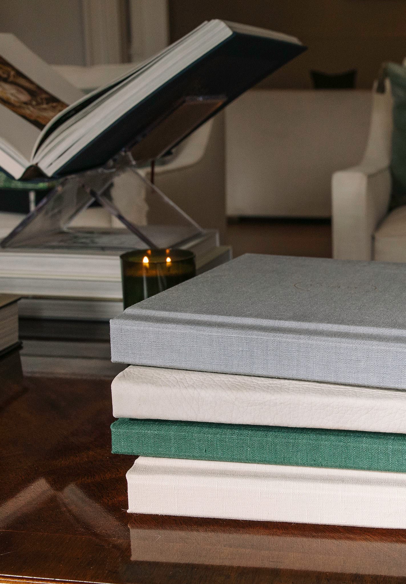 A stack of RedTree Albums in linen covers
